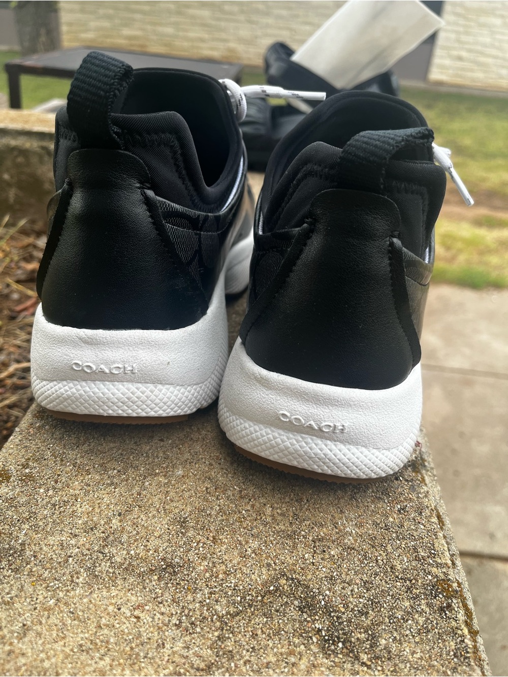 Coach Black and White Low-Top Slip-On Sneakers
